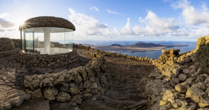 Stairway and viewing platform at the Mirador del Río viewpoint, in the evening light with sun