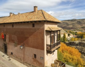 Alberque hostel building with flags flying, historic buildings in medieval village of Albarracín,