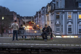 Essen-Steele S-Bahn station, passengers waiting for the train late afternoon, in autumn, Essen,