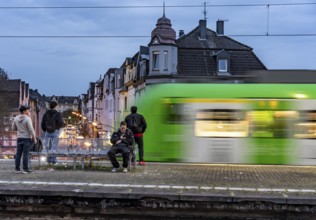 Essen-Steele S-Bahn station, passengers waiting for the train late afternoon, in autumn, Essen,