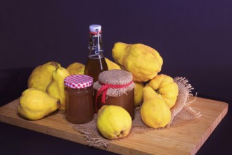 Still life with quinces, homemade quince jelly and quince liqueur, autumn, Germany
