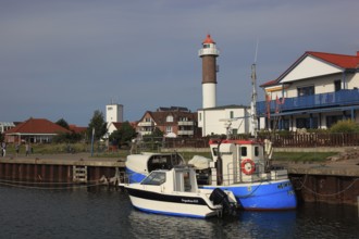 Timmendorf lighthouse on the island of Poel on the Baltic Sea, harbour in the foreground,