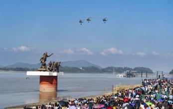 The Indian Air Force aerobatic team performs during an air show as part of the 93rd Air Force Day