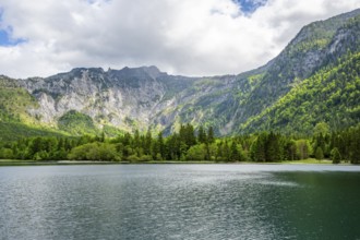 Landscape of Lake Offensee after rain when the sun comes through the clouds in spring,