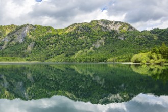 Landscape of Lake Offensee after rain when the sun comes through the clouds in spring,