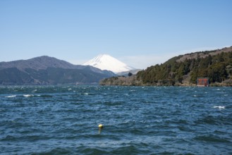 View of Lake Ashi with Mount Fuji volcano and peace torii from Hakone Shrine, Hakone, Japan