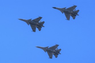 Indian Air Force aerobatic team performs during rehearsals ahead of the air show organised as part