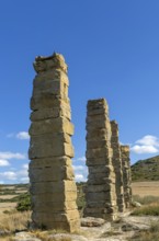 Stone columns of ancient aqueduct, Roman site of Los Banales, near Layana, Zaragoza province,