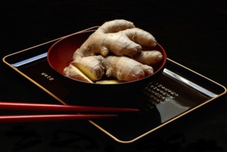 Ginger, ginger root in tea bowl, Zingiber officinale, tea preparation