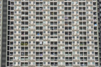 Exterior façade of a residential high-rise building of Condo U (a brand or series name of the Thai