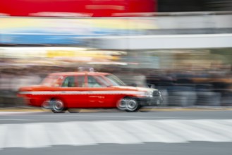 Black taxi driving, motion blur, long exposure, Shubuya Crossing, Shibuya, Tokyo, Japan