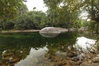 Turquoise blue water between rocks in the tropical rainforest of Babinda Boulders Queensland