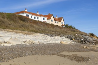 Clifftop houses at risk from coastal erosion, Thorpeness, Suffolk, North Sea coast, England, UK