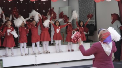 Children celebrate the 102nd anniversary of the Republic Day of Turkey, a national holiday