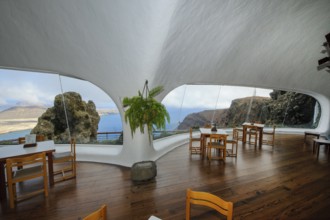 Interior of café with panoramic window in building designed by Cesar Manrique with the
