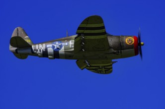An RC model of a Republic P-47 Thunderbolt during a demonstration as part of an air show at the