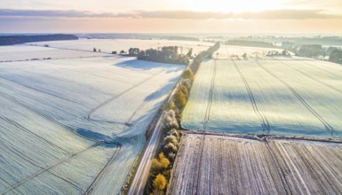 Bird Eye Perspective of Frost Covered Farmland. Seasonal Agricultural Scenery, winter and autumn