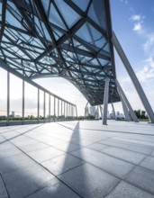 Modern architectural framework with glass and steel structure, glass facade with a greed of steel