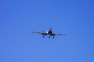 A Jakovlev Jak-52 with registration LY-HLZ during a flight demonstration as part of an air show on