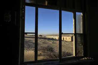 View from a former dwelling house into the desert, Kolmanskop, restricted diamond area, Karas
