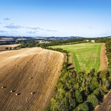 Straw bales in the Scottish fields from a drone, Southeast Scotland, UK
