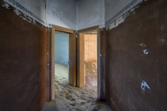 Sand mountains in a former dwelling house, interior photograph, Kolmanskop, restricted diamond