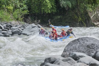 A group of people white water rafting, Costa Rica, Central America