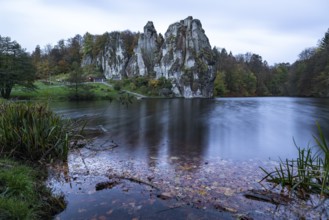 Externsteine in autumn, view over the Wiembecke pond, Teutoburg Forest, Horn-Bad Meinberg, North
