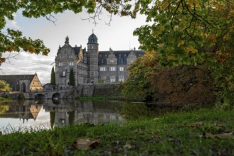 View across the castle pond to Hämelschenburg Castle, a moated castle and major work of the Weser