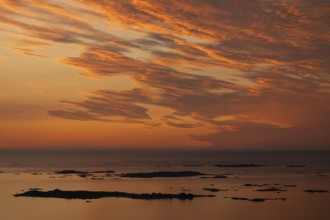 Offshore islands and skerries, sea, dramatically illuminated clouds, sunset, Otroya or Otrøya