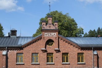 Brick façade with inscription Werla, former paper factory and mill for the production of groundwood