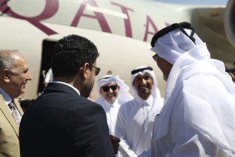 Syrian Health Minister Musab al-Omar welcomes a Qatari aircraft loaded with medical and