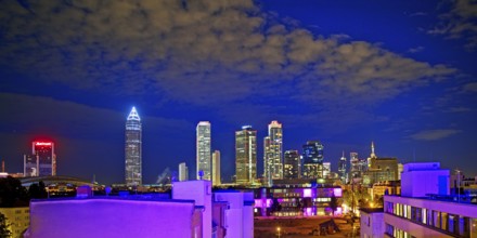 Rooftop day with colourfully illuminated houses for a techno party on the roof with a view of the