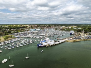 Wight Light car ferry to Isle of Wight on Lymington River and marina from drone, Lymington, New