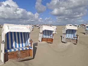 Sand drifts on the North Sea beach, blue sky, white clouds, summer, sun, sand, beach chairs, on the
