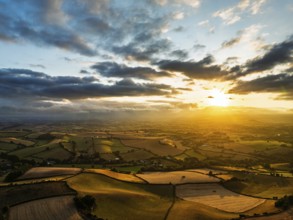 Sunset of Fields and Farms over Devon from a drone, Torquay, Torbay, Devon, England, United Kingdom
