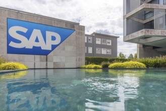 Logo and building of the software company SAP SE. Walldorf, Baden-Württemberg, Germany