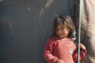 Syrian children playing in a refugee camp near the Turkish border on World Children's Day. Aleppo,