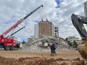 Turkish civil defense teams (AFAD) search for survivors under the rubble after a powerful 7