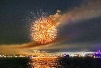 Lake Night Festival Constance. Water fireworks over the German shore and the neighbouring Swiss