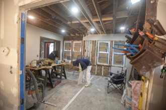 Detroit, Michigan - Workers remodel a house in the Morningside neighborhood that had been vacant