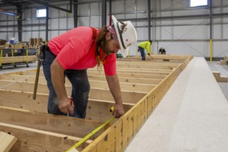Romulus, Michigan - Workers build apartments in Ginosko Modular 's factory using modular