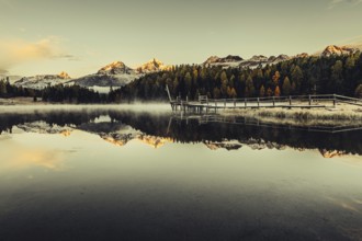 Lake Staz near Sankt Moritz in the Engadin in Switzerland. Morning atmosphere with fog in autumn.
