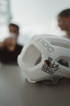 Young man taking a coffee break while riding his racing bike on Lake Garda. Sunny weather and dolce