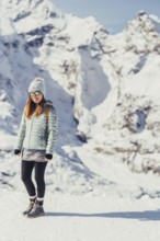 Woman in wintry surroundings in the Engadine in Switzerland
