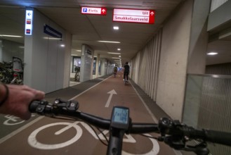 Ride your bike into and out of the bicycle car park at Utrecht Centraal station, Stationsplein,