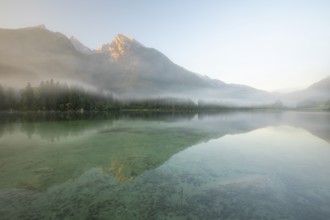 Magical sunrise with fog at Hintersee near Ramsau in Berchtesgadener Land