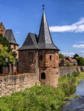 The old town centre with the town wall and the Seemenbach stream, Büdingen, Hesse, Germany