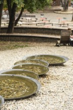 Small park with seating, a playground and a fountain at the entrance to Trencin Castle, Capital of