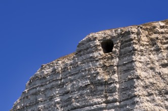 View of the Eye of the Panda, L'oeil du Panda, rock window, cave, in the rock arch Falaise